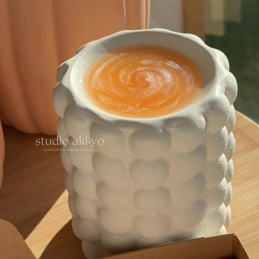 Bubble cream speckle wax burner styled in a pumpkin, seasonal decor.