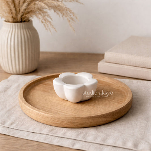 Wooden tray with a white ceramic dish on a neutral background, featuring the brand 'studio akiyo'.