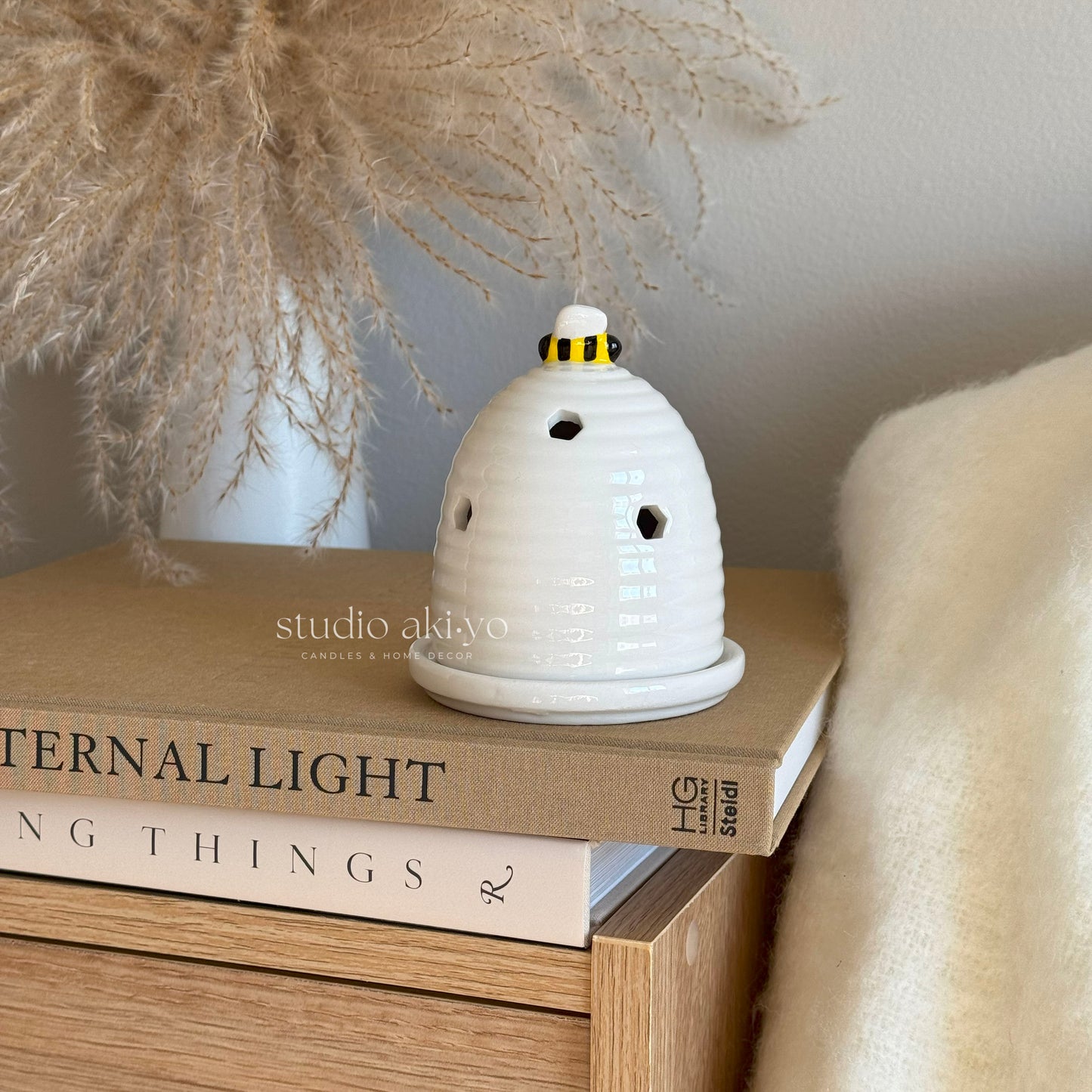 White ceramic beehive incense cone and tealight holder with bee topper