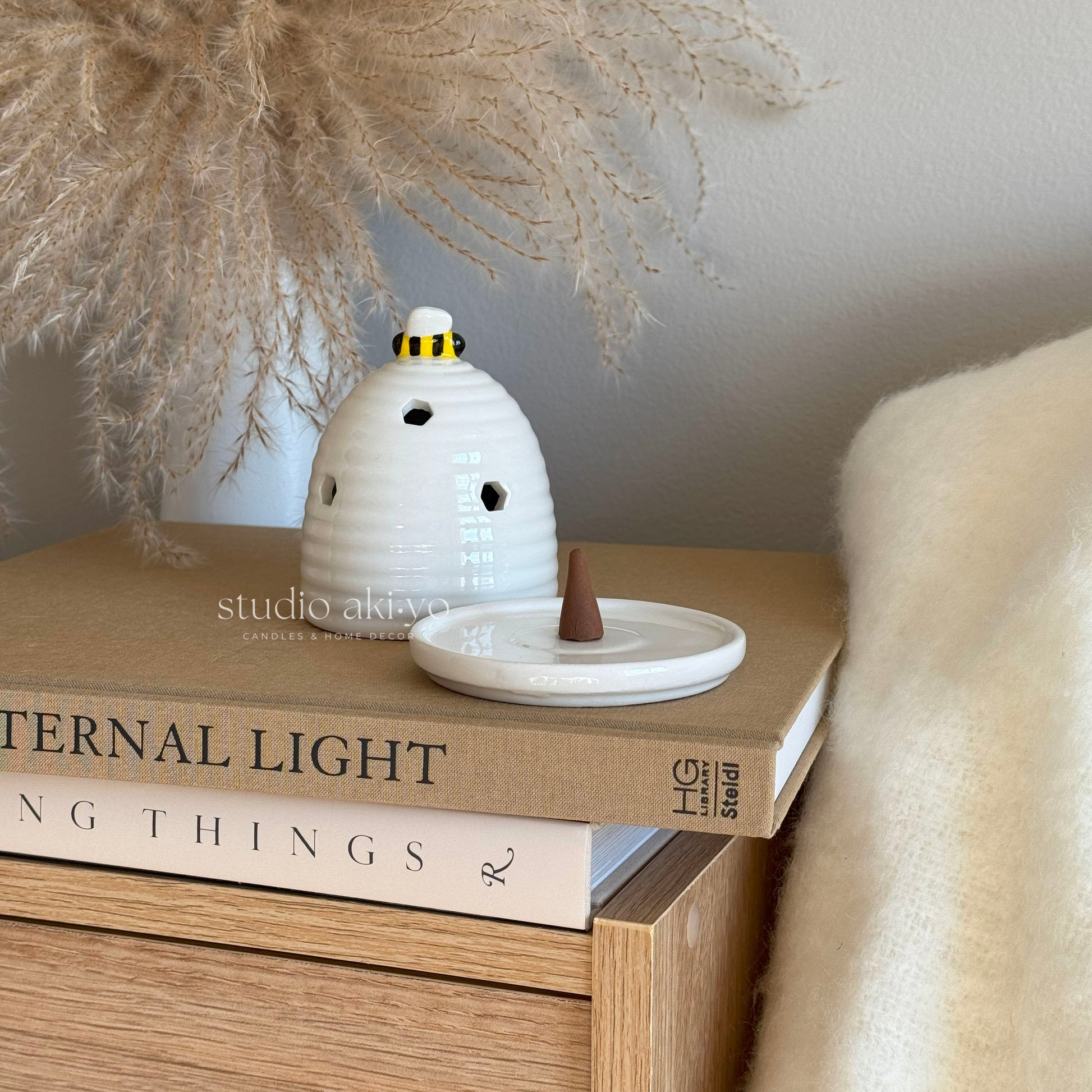 White ceramic beehive incense cone and tealight holder with bee topper