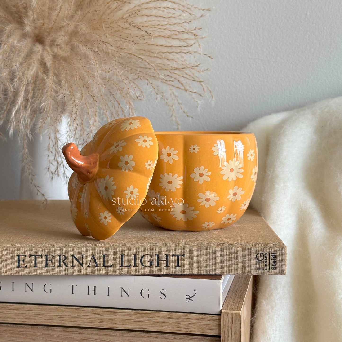 Groovy 60s-style ceramic floral pumpkin wax melt burner with lid on the side