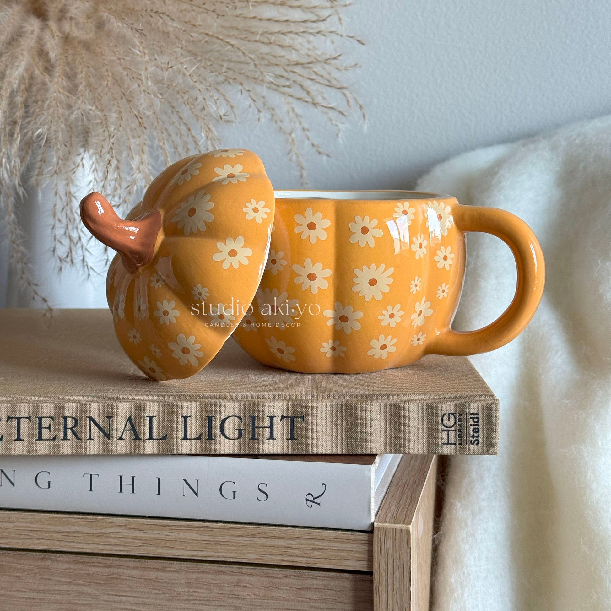 Groovy Pumpkin Summerween Ceramic Mug with lid on the side