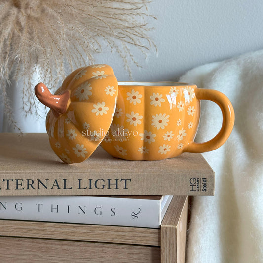 Groovy Pumpkin Summerween Ceramic Mug with lid on the side