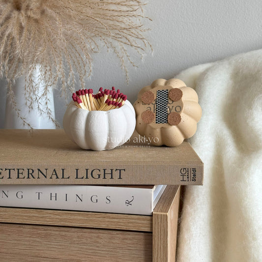 Pumpkin match holder and striker in neutral shades