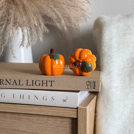 Ceramic pumpkin salt and pepper shaker set with orange glaze