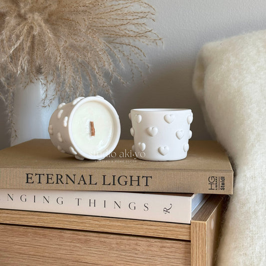 Soft floral musk candle with crackling wood wick in artisan heart shaped vessel