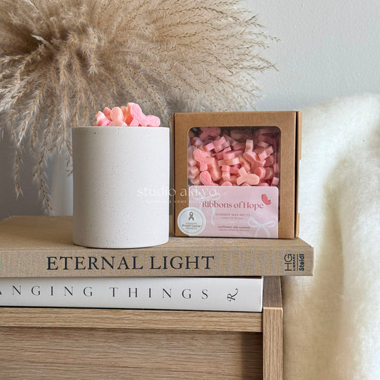 Scoopable wax melts in soft pink shades for breast cancer awareness