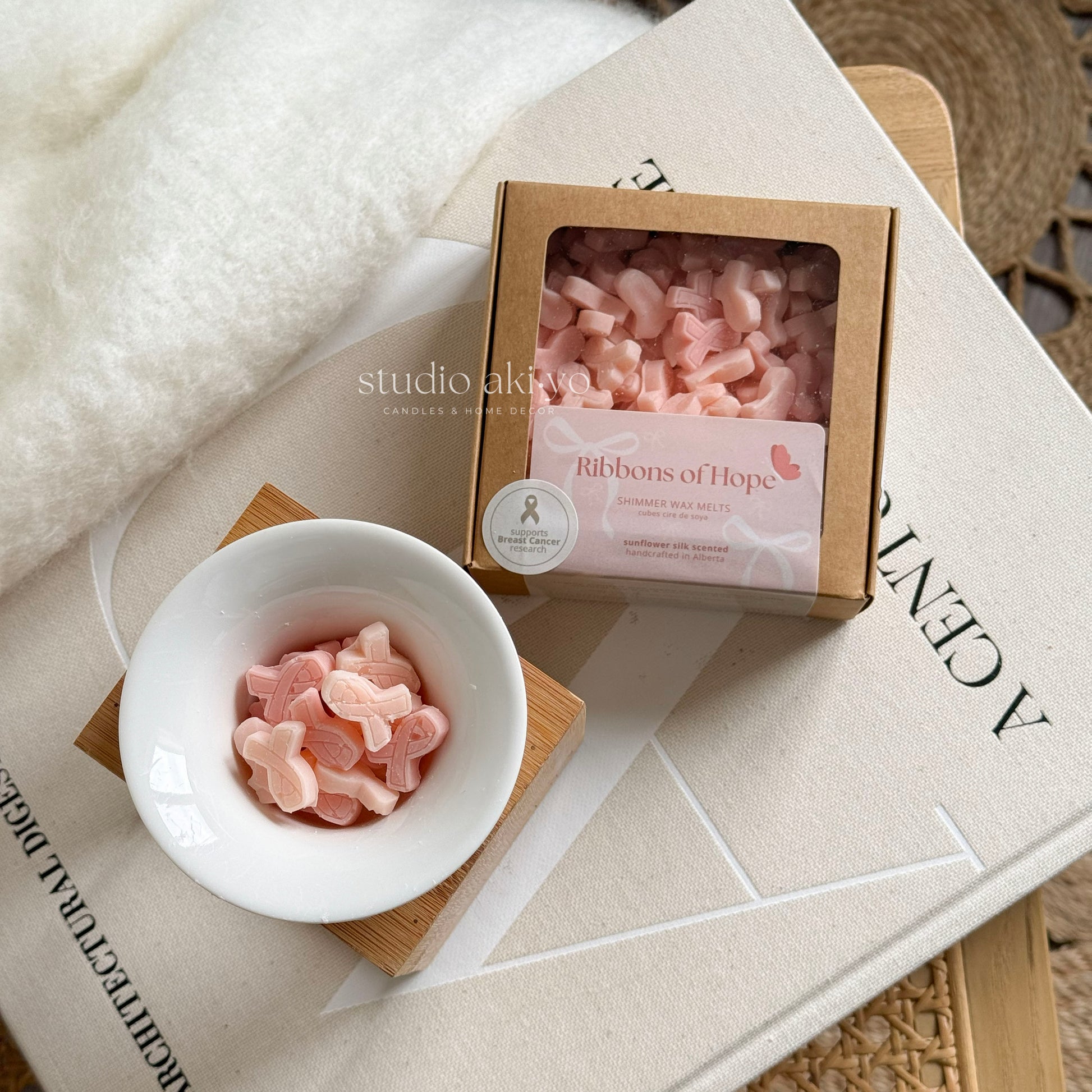 Scoopable wax melts in soft pink shades for breast cancer awareness