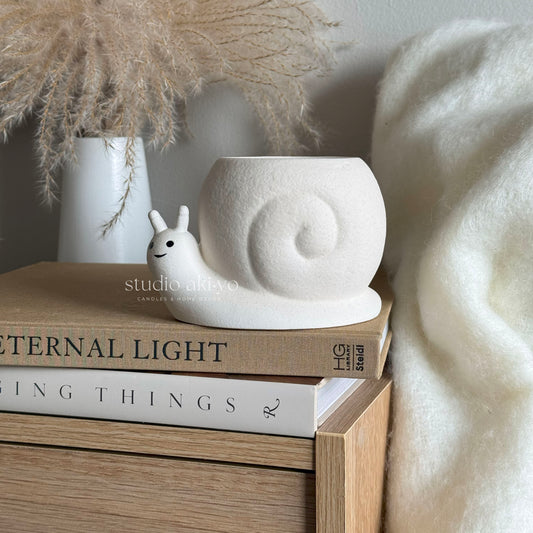 Handmade ceramic snail wax melt burner in cream speckle finish