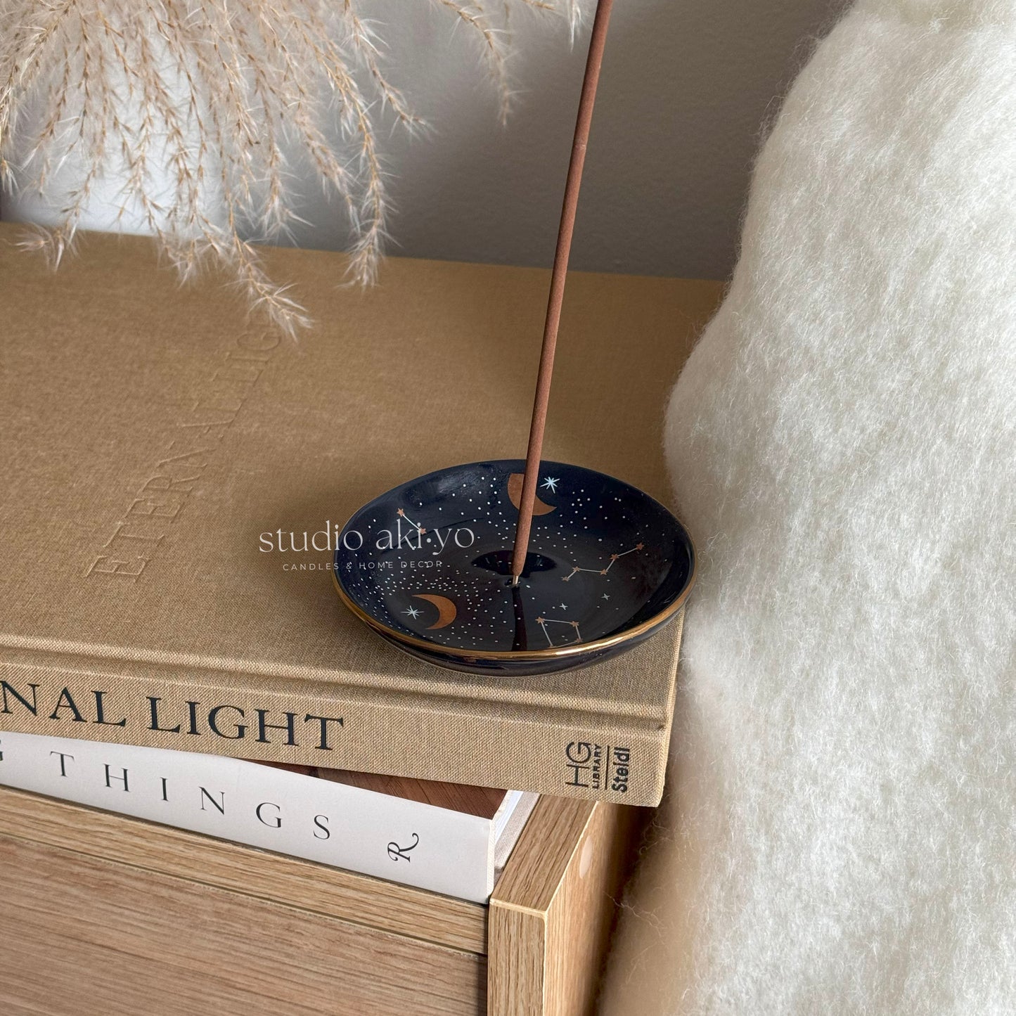 Star Constellation incense holder catching ash from burning incense stick