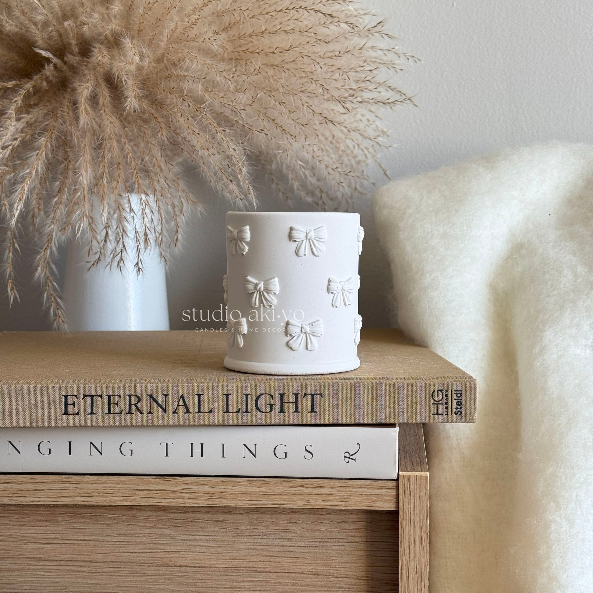 hand poured sunflower silk candle into handmade candle  vessel in support of breast cancer awareness