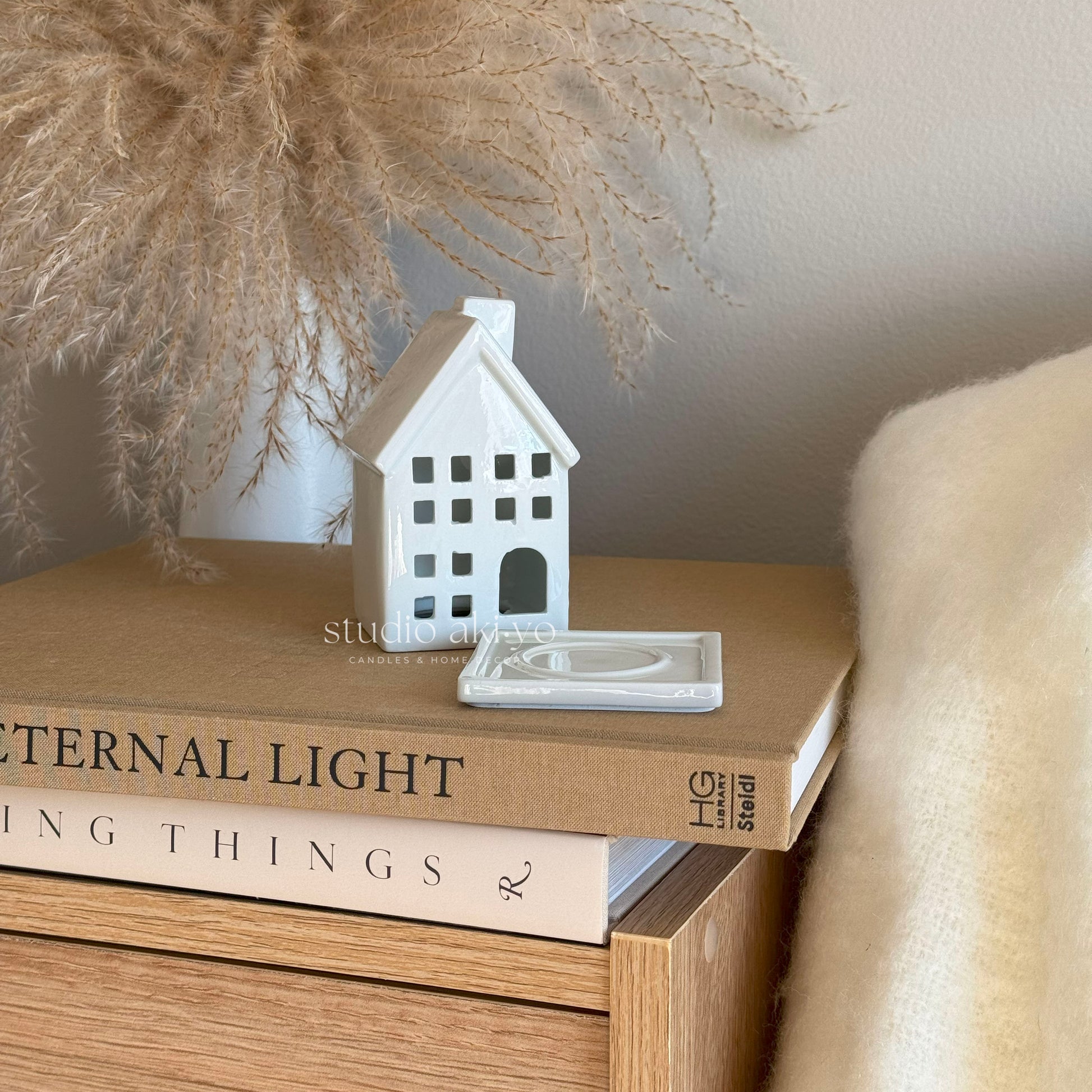 Side view of ceramic house burner showing cutouts for smoke to rise