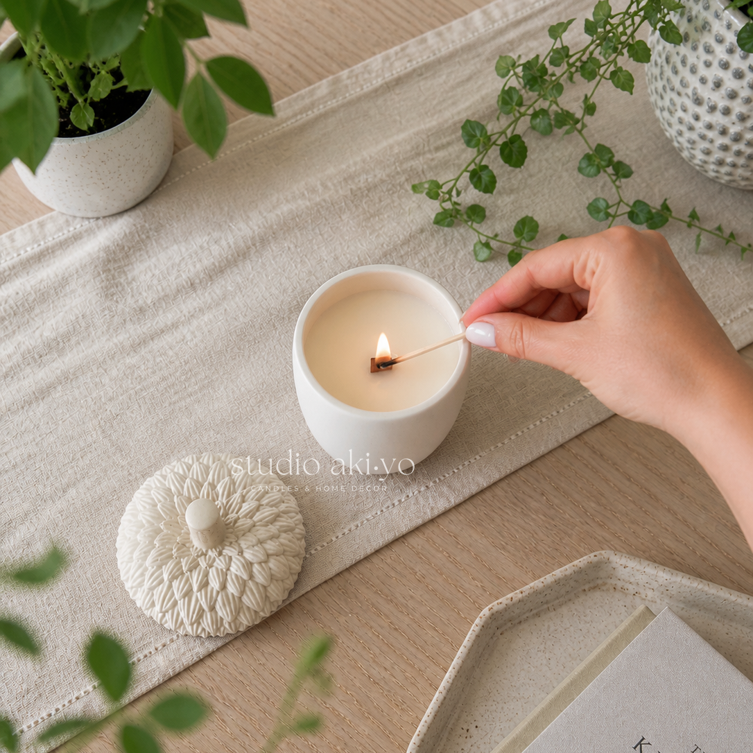 Hand lighting enchanted forest candle from studio akiyo