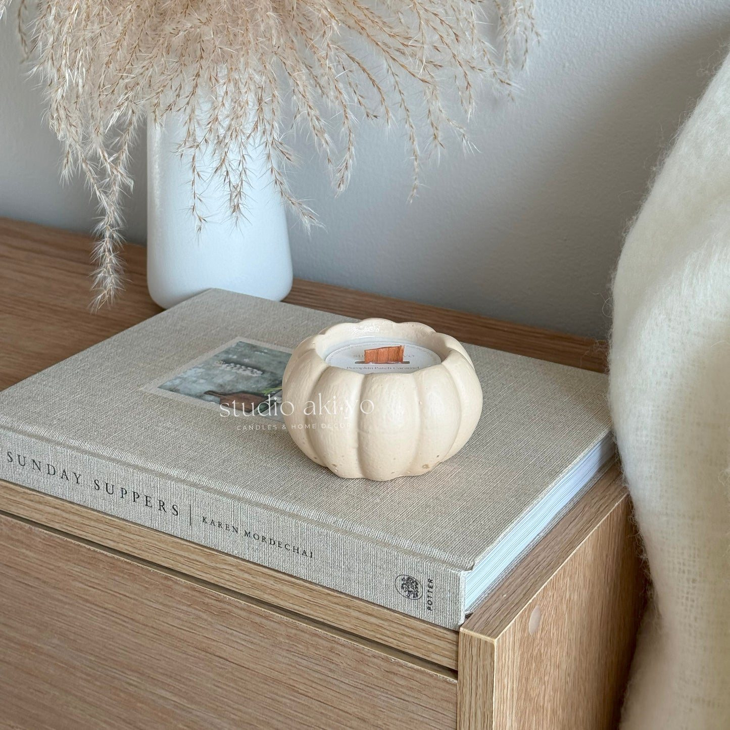 Hand-poured pumpkin caramel fall candle in handcrafted pumpkin vessel