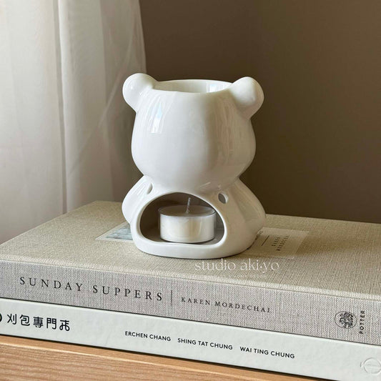 Behind view of white ceramic teddy bear wax melts and fragrance oil burner