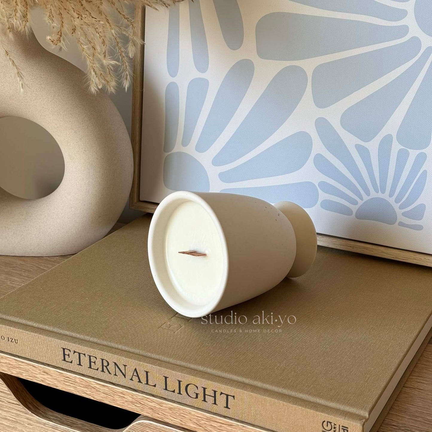 Hand-poured coffee candle with wood wick in ceramic-style jar