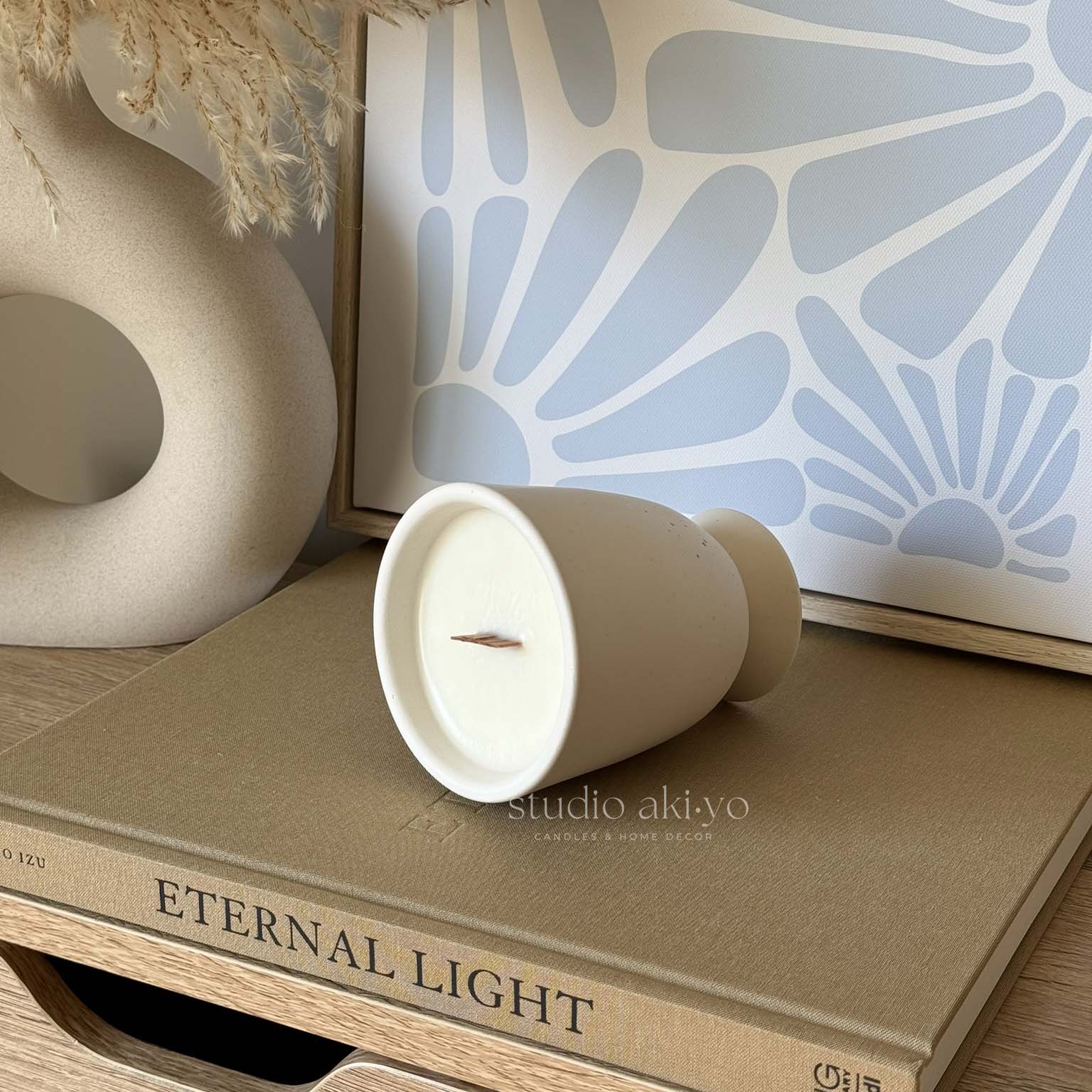 Hand-poured coffee candle with wood wick in ceramic-style jar