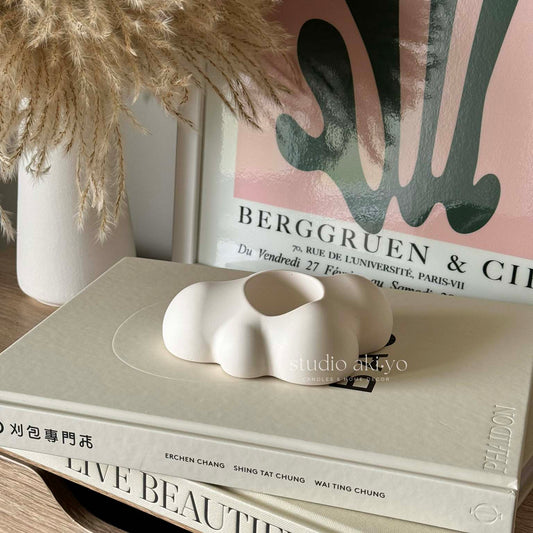 Modern cloud tealight decor styled in a soft neutral room