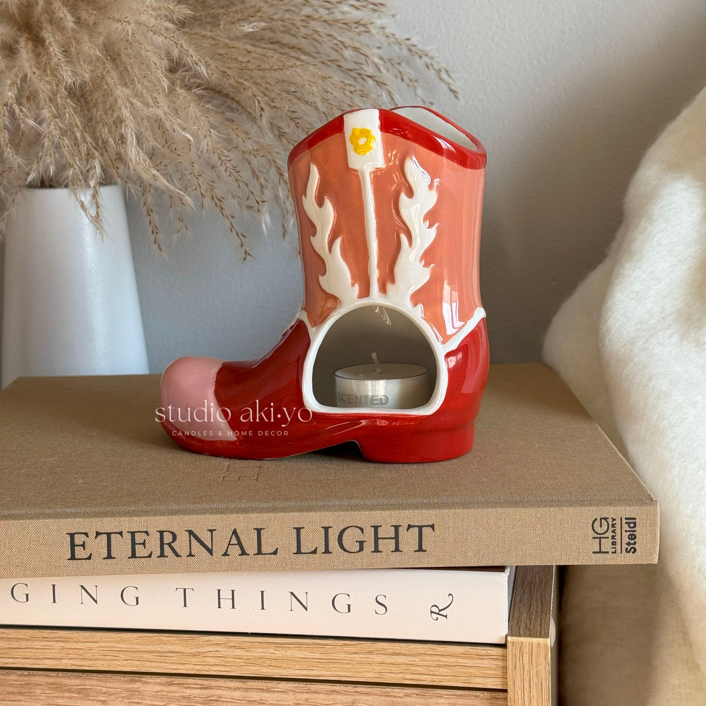 Cowboy boot wax melt burner styled in Western home décor setting