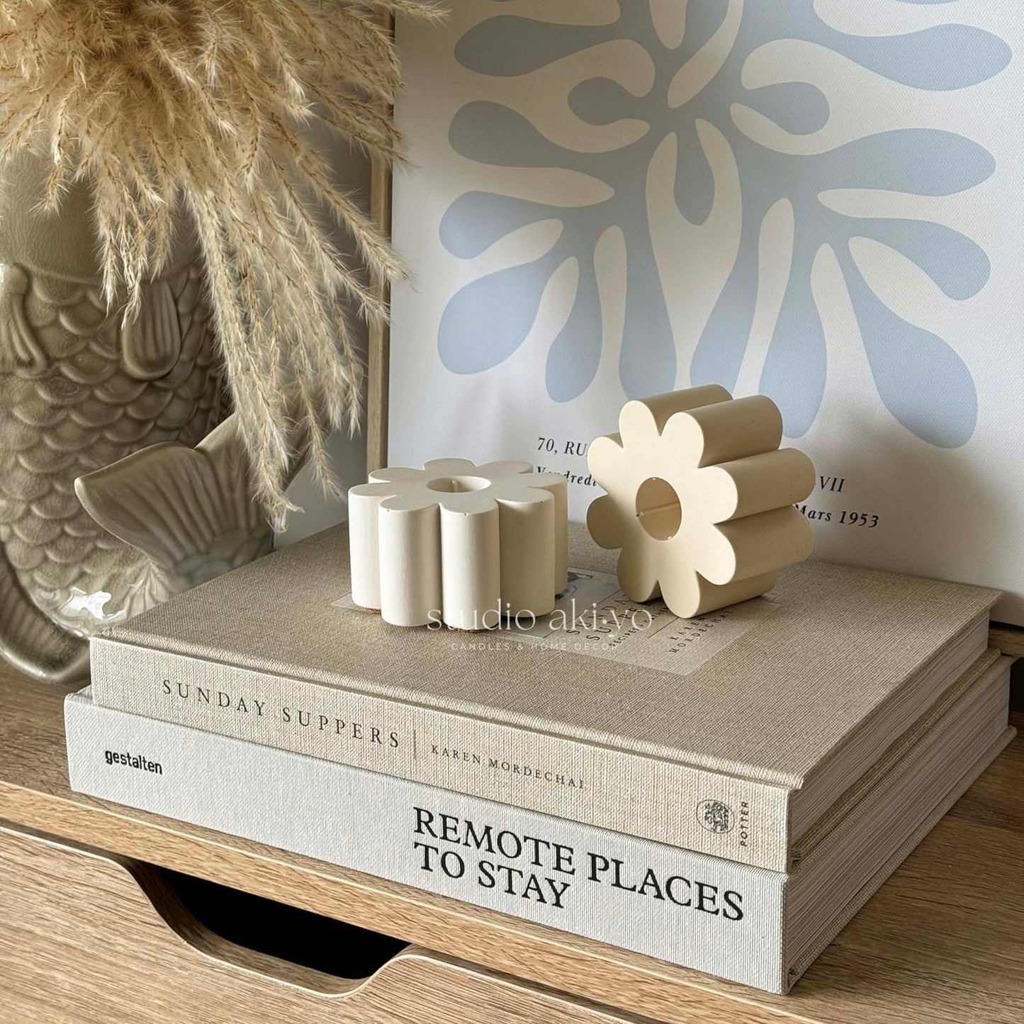 Minimalist floral candle holder styled on soft-toned surface