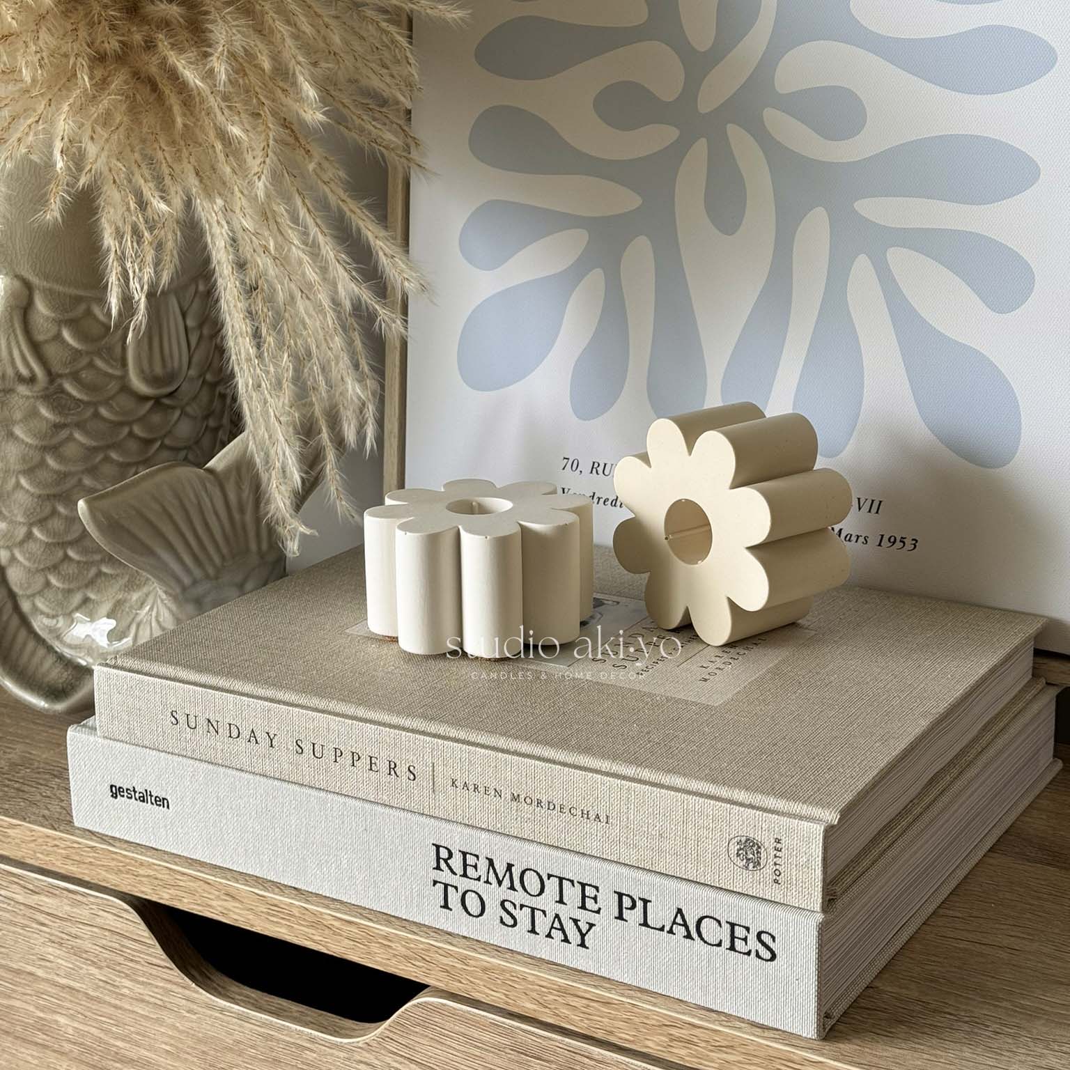 Minimalist floral candle holder styled on soft-toned surface