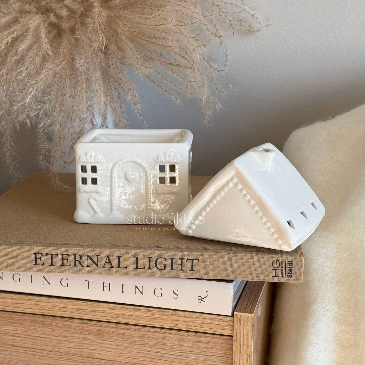 Side view of gingerbread house tealight wax warmer with removable lid