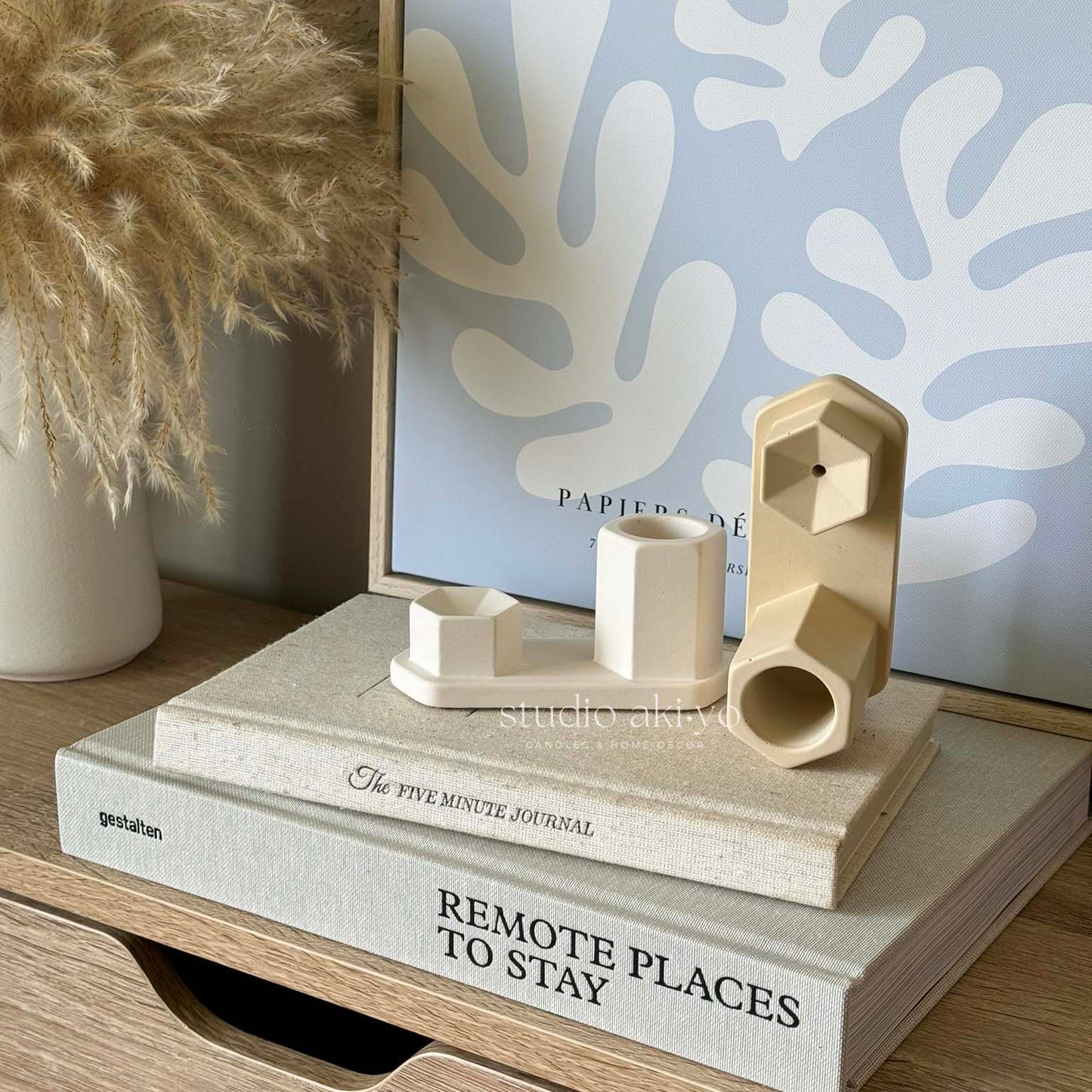 Minimalist jesmonite hexagon incense ash catcher styled on a wooden shelf