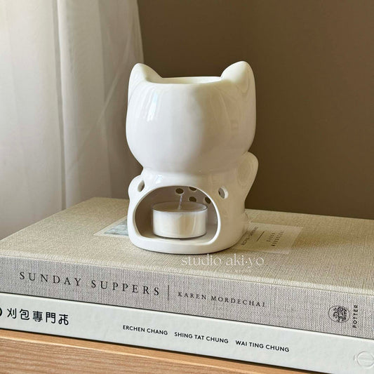 Behind view of lucky cat ceramic wax warmer for tealight candles and wax melts