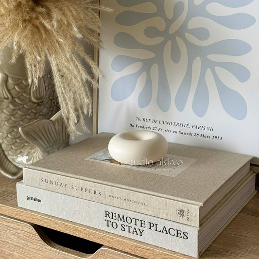 Minimalist taper candle holder made from jesmonite in neutral tone