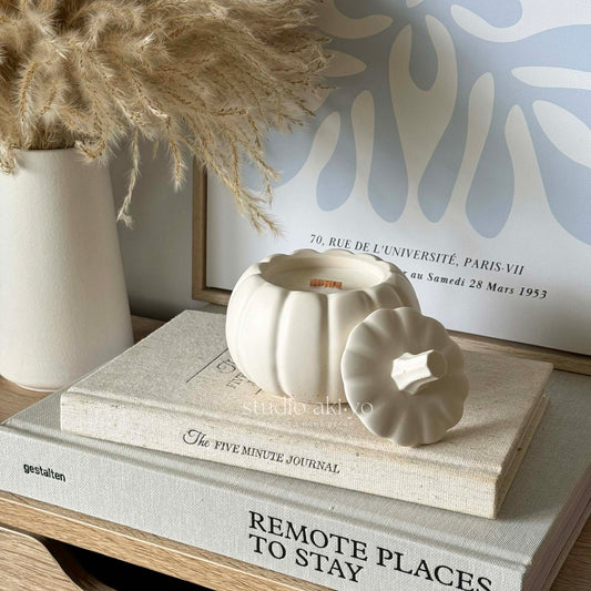 Pumpkin chai scented candle with wood wick in artisan pumpkin candle jar