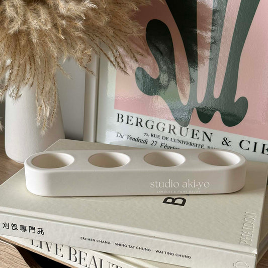 Quadruple jesmonite tealight candle holder on neutral background