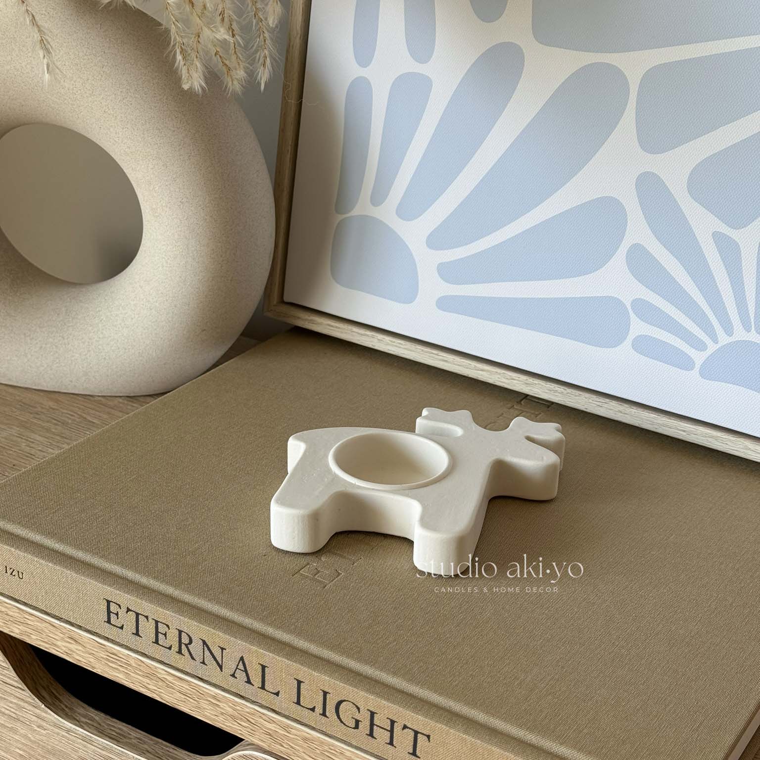 Cream white ceramic reindeer tealight candle holder with cork base