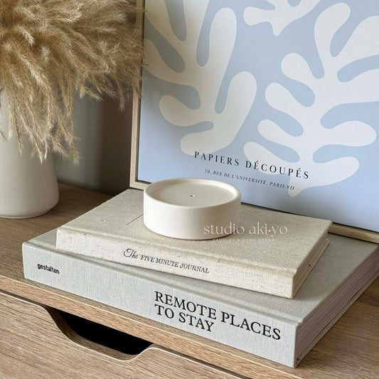 Modern incense holder made from jesmonite styled on a shelf