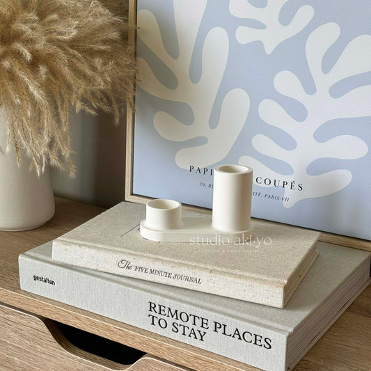 Minimalist jesmonite incense burners styled on a wooden shelf