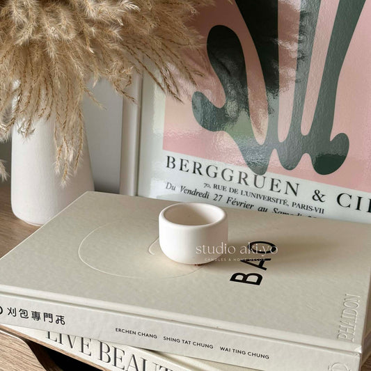 Scandi-style ceramic tealight candle holder on neutral background