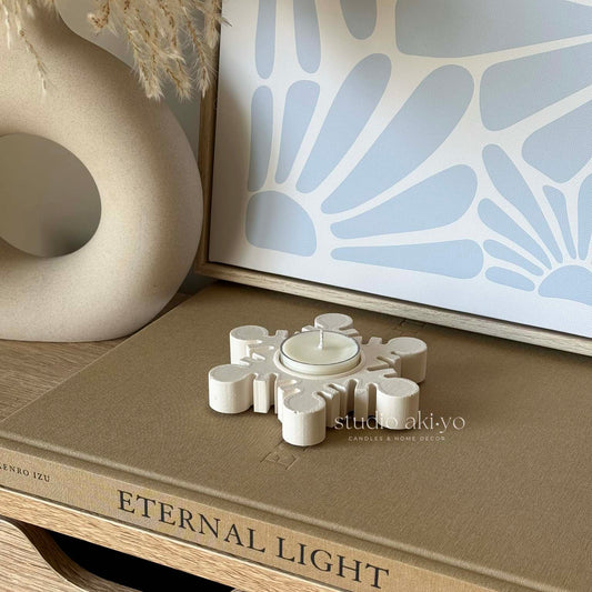 Minimal Japandi winter decor with snowflake tealight holder