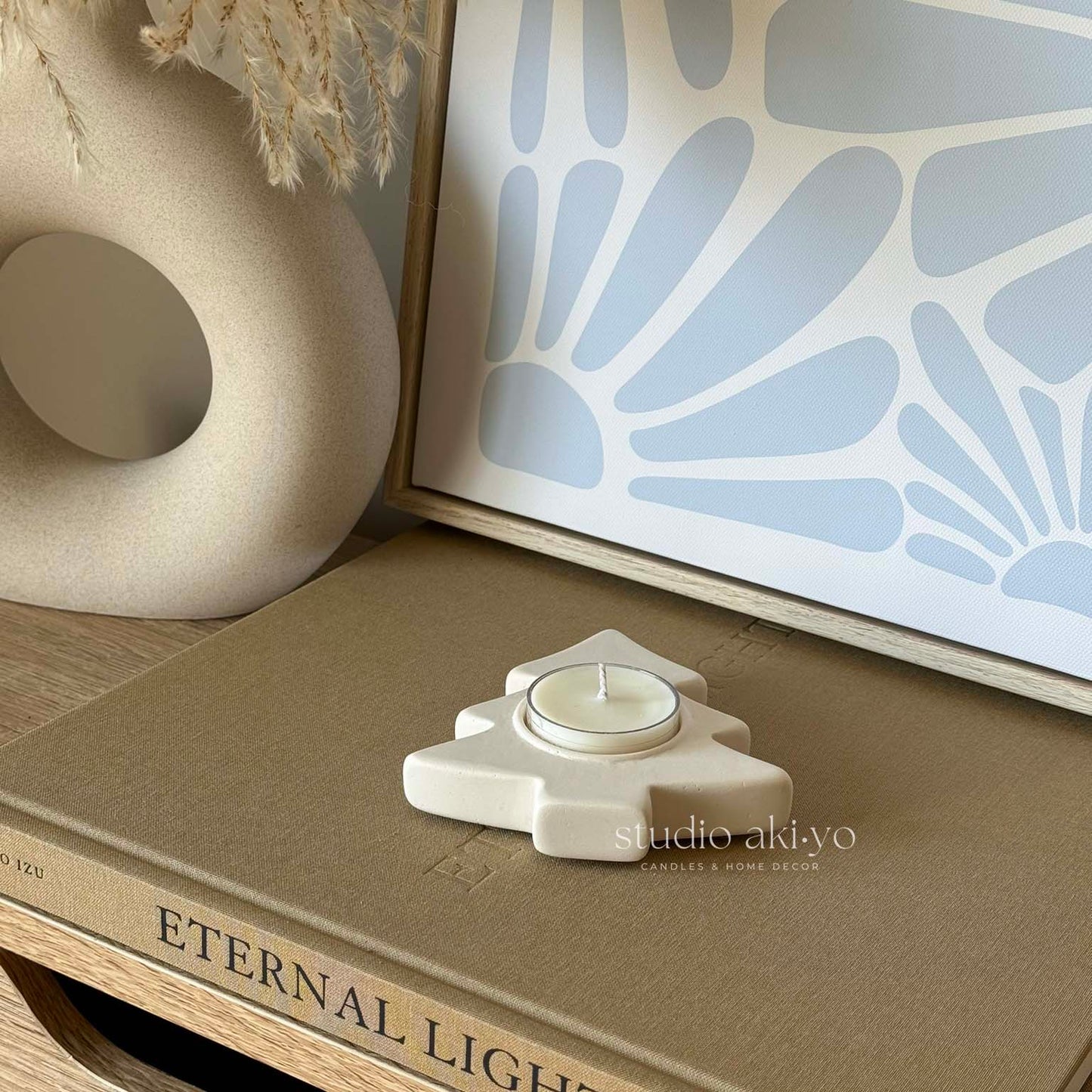 Minimal Japandi winter decor featuring tree tealight holder