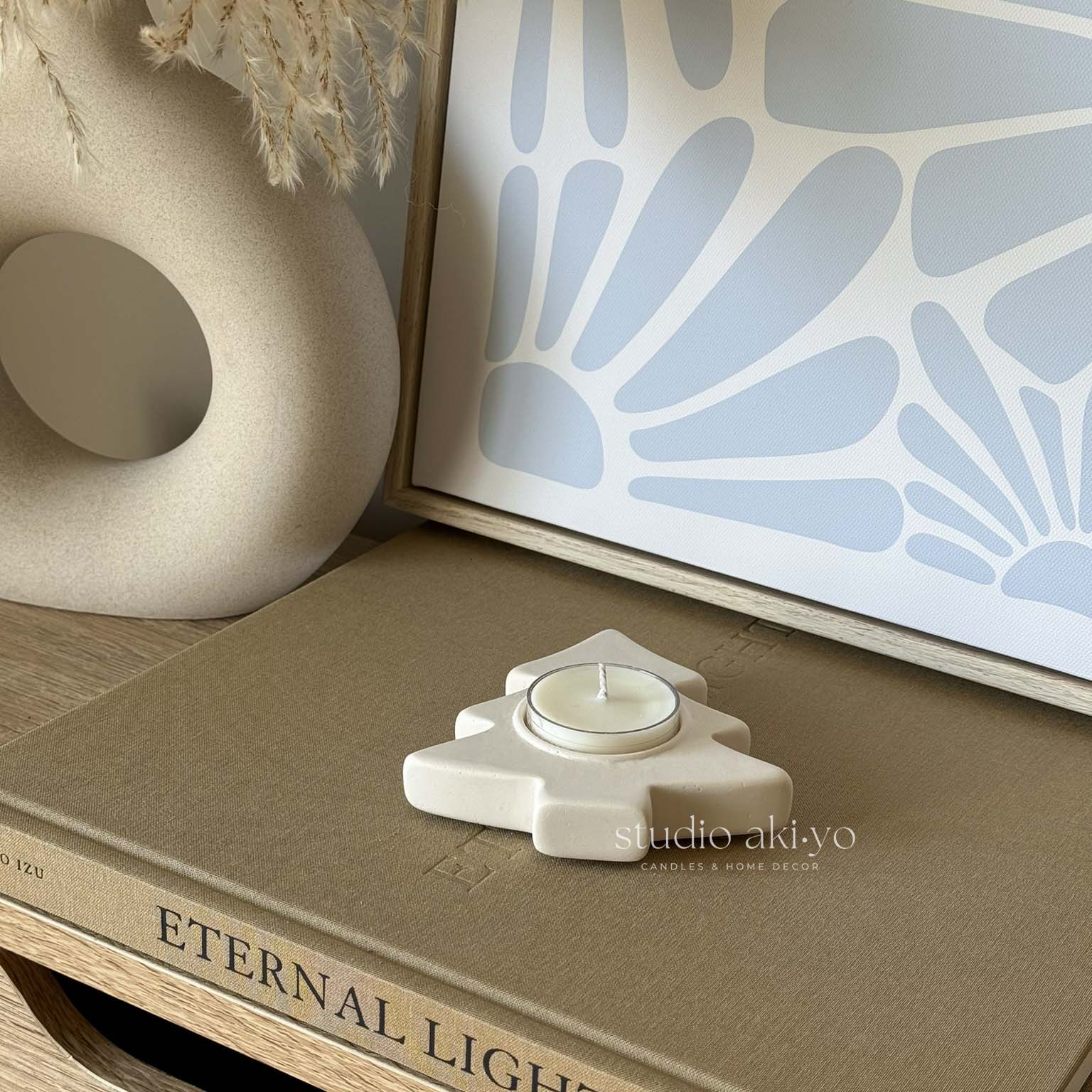 Minimal Japandi winter decor featuring tree tealight holder