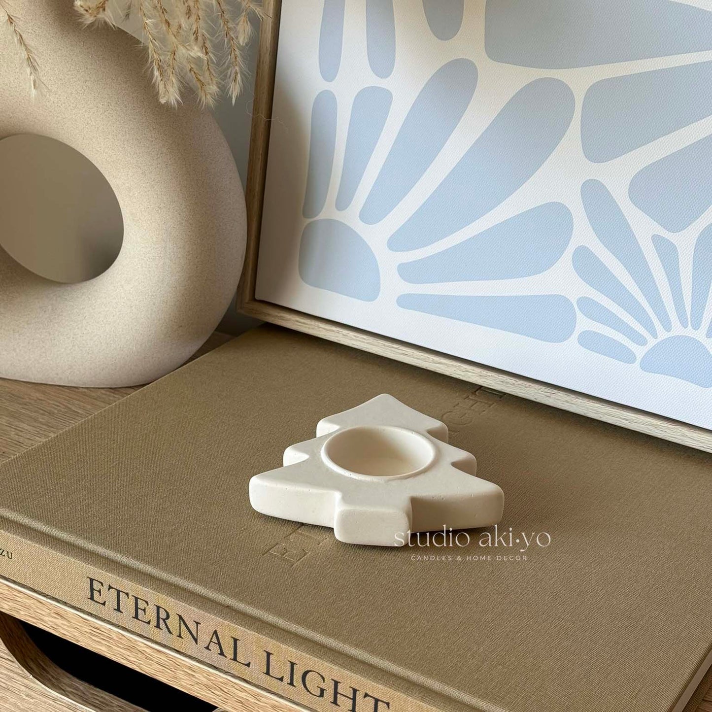 Holiday tree-shaped tealight candle holder in neutral jesmonite