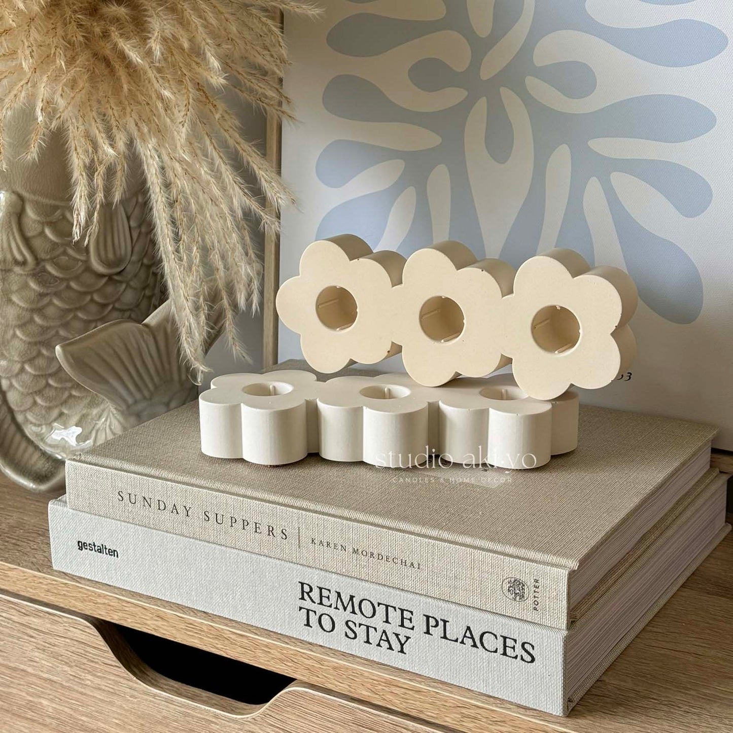 Triple flower-shaped taper candle holder handcrafted from jesmonite