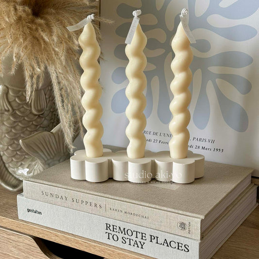 Jesmonite candle holder with three floral taper slots in neutral finish