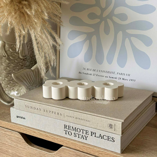 Triple flower-shaped taper candle holder handcrafted from jesmonite