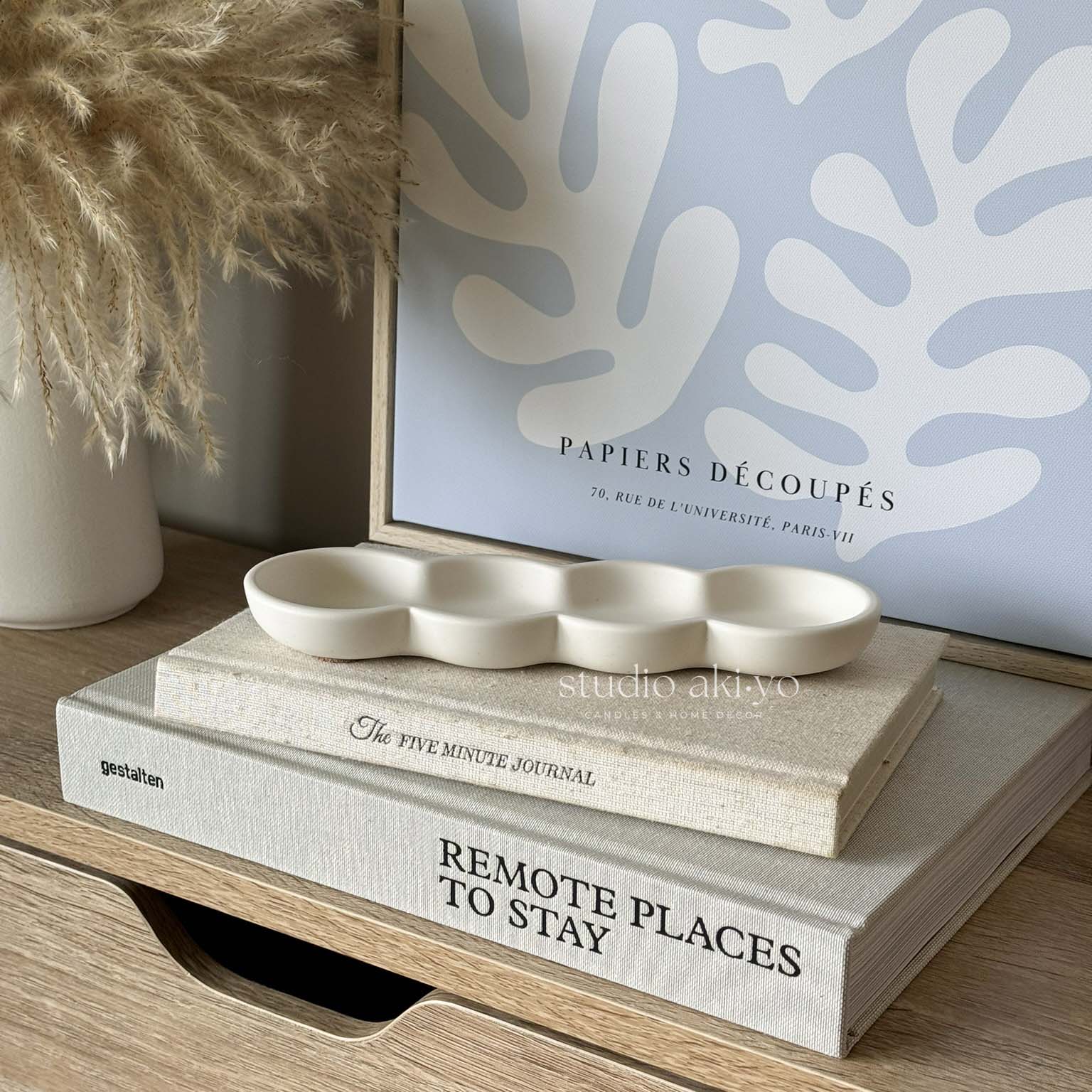 Wavy jesmonite incense holder with soft neutral finish on white background