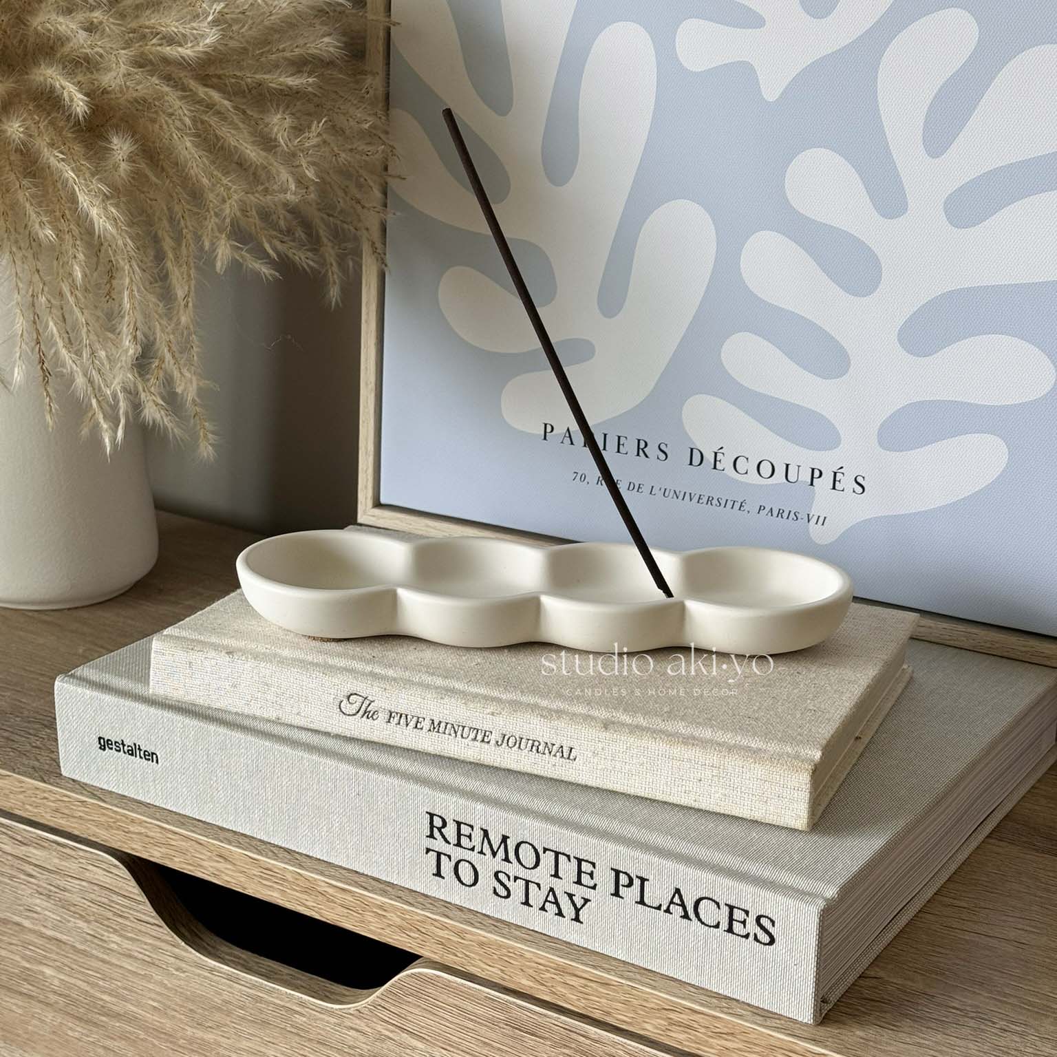 Modern incense stick holder with organic wave design