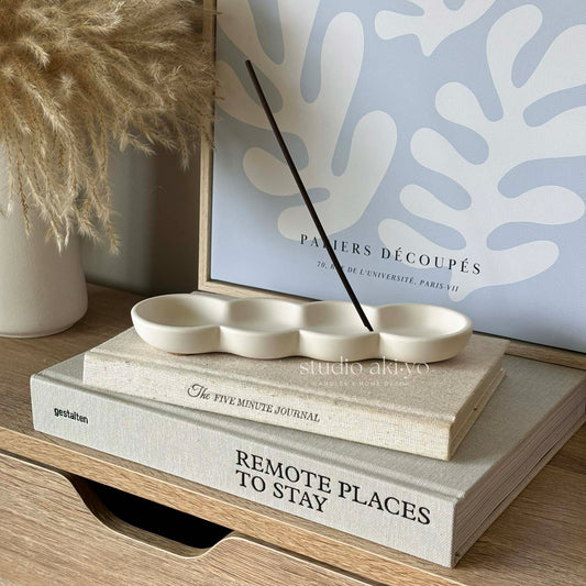 Modern incense stick holder with organic wave design