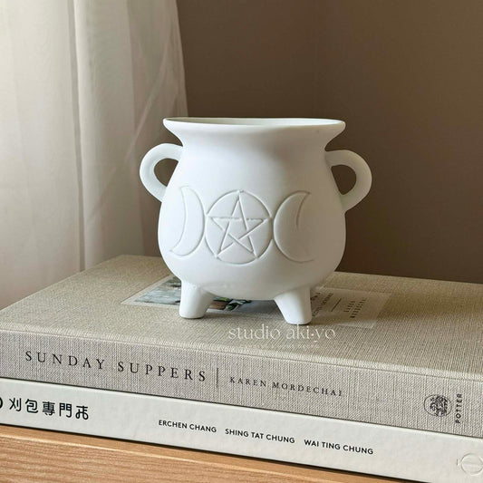 Front view of white triple moon ceramic tealight wax warmer in cauldron shape