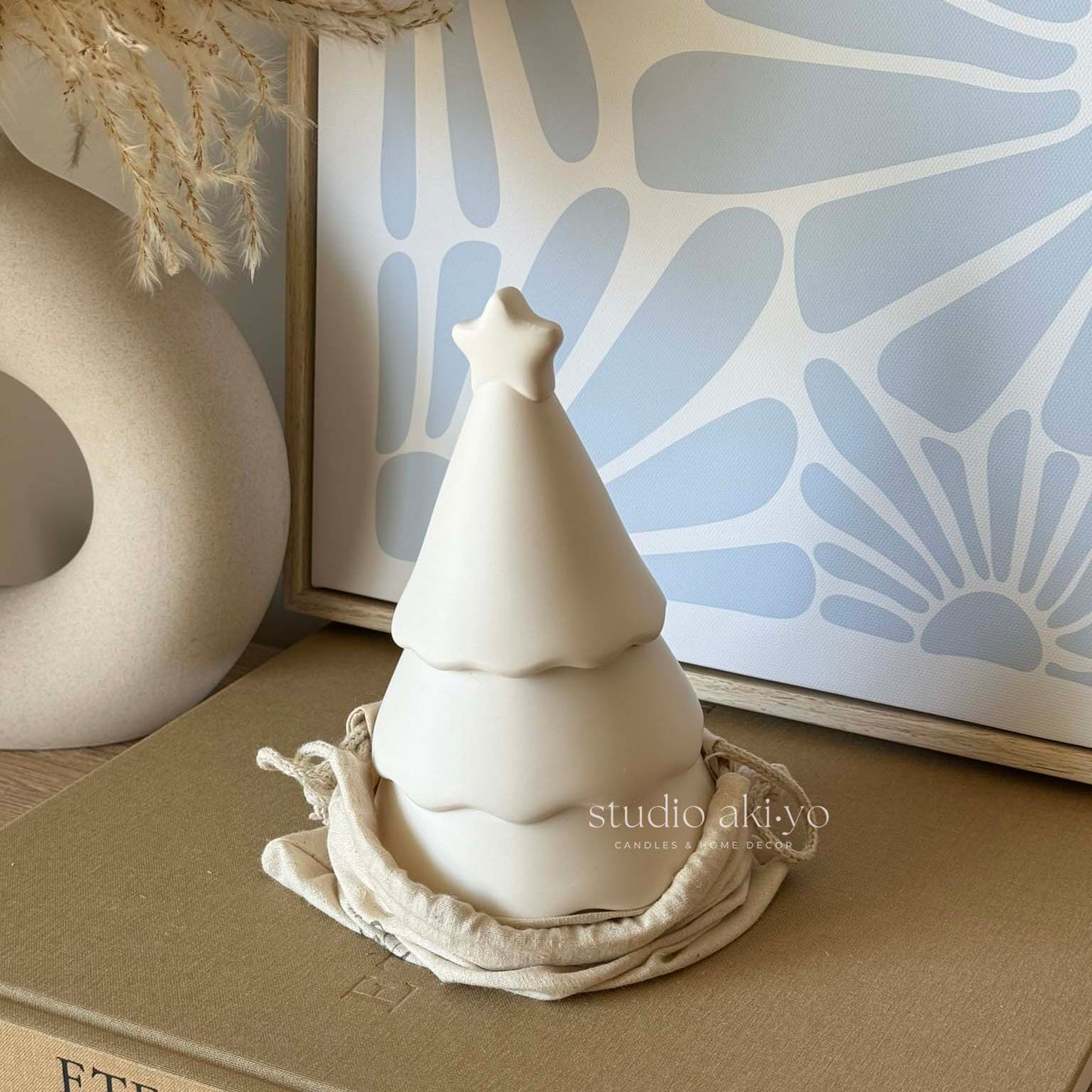 Winter wood wick candle in artisanal festive tree candle jar