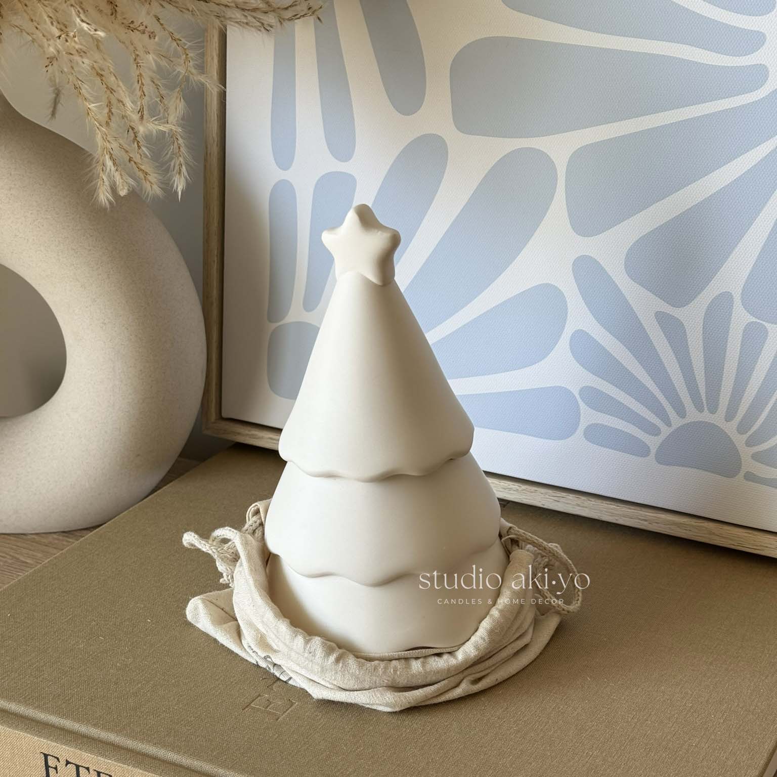 Winter wood wick candle in artisanal festive tree candle jar