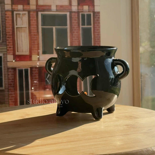 Black ceramic triple moon cauldron wax melt burner with cutout moons