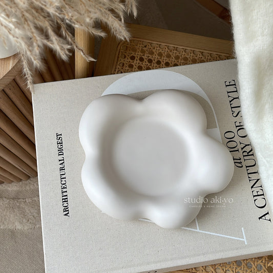 Irregular flower-shaped trinket tray in soft neutral jesmonite